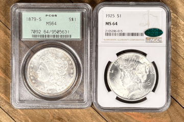 Graded Morgan and Peace dollar silver coins.